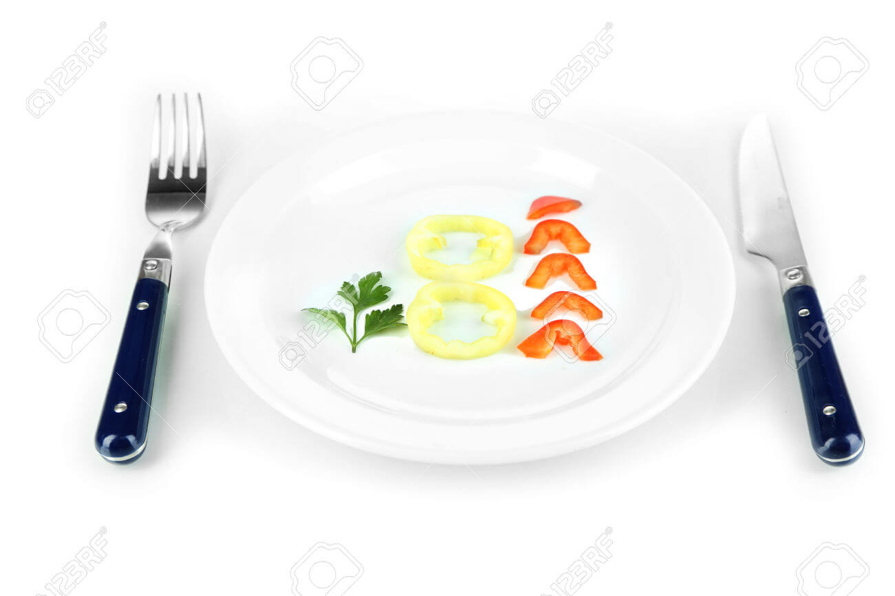 Small portion of food on big plate isolated on white